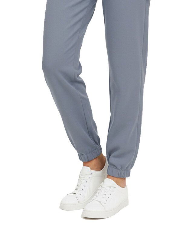 Švelnaus ir tampraus audinio medicininės kelnės su guma. Pilkos